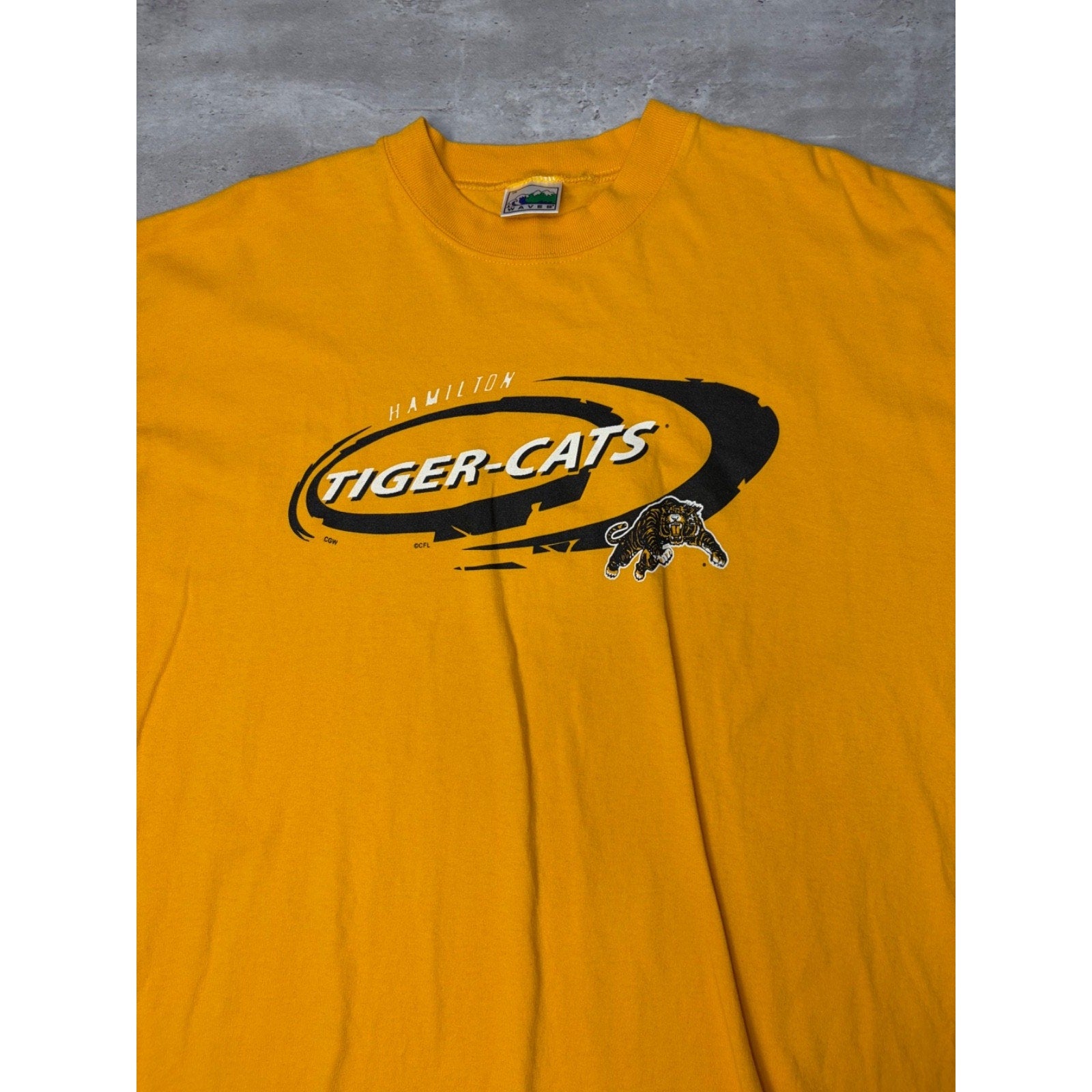 Vintage 90s Hamilton Tiger Cats CFL Spellout Logo Graphic T-Shirt Size Large