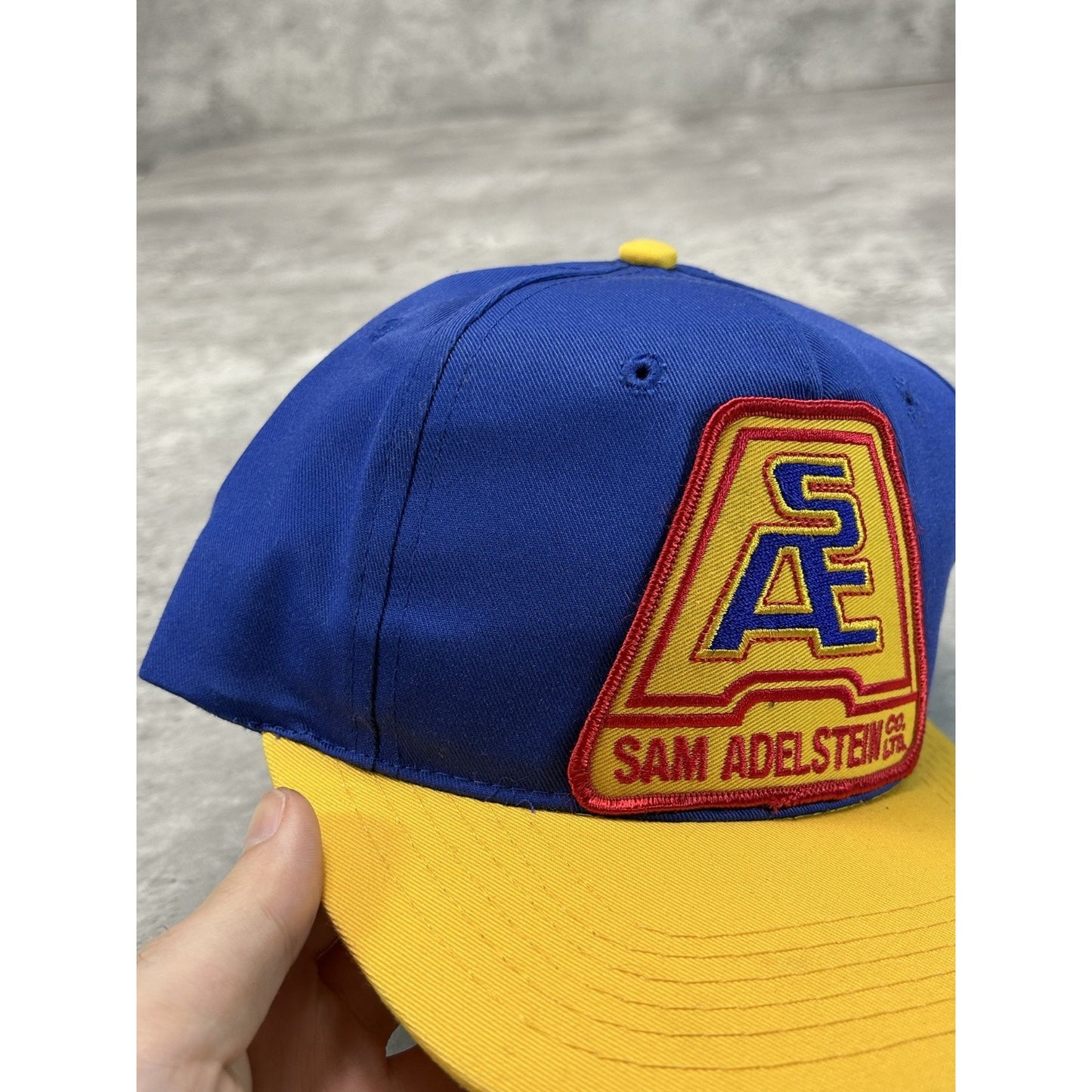 Vintage 90s Sam Adelstein Embroidered Spellout Logo Snapback Hat OSFA