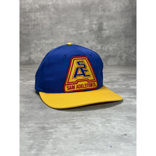 Vintage 90s Sam Adelstein Embroidered Spellout Logo Snapback Hat OSFA