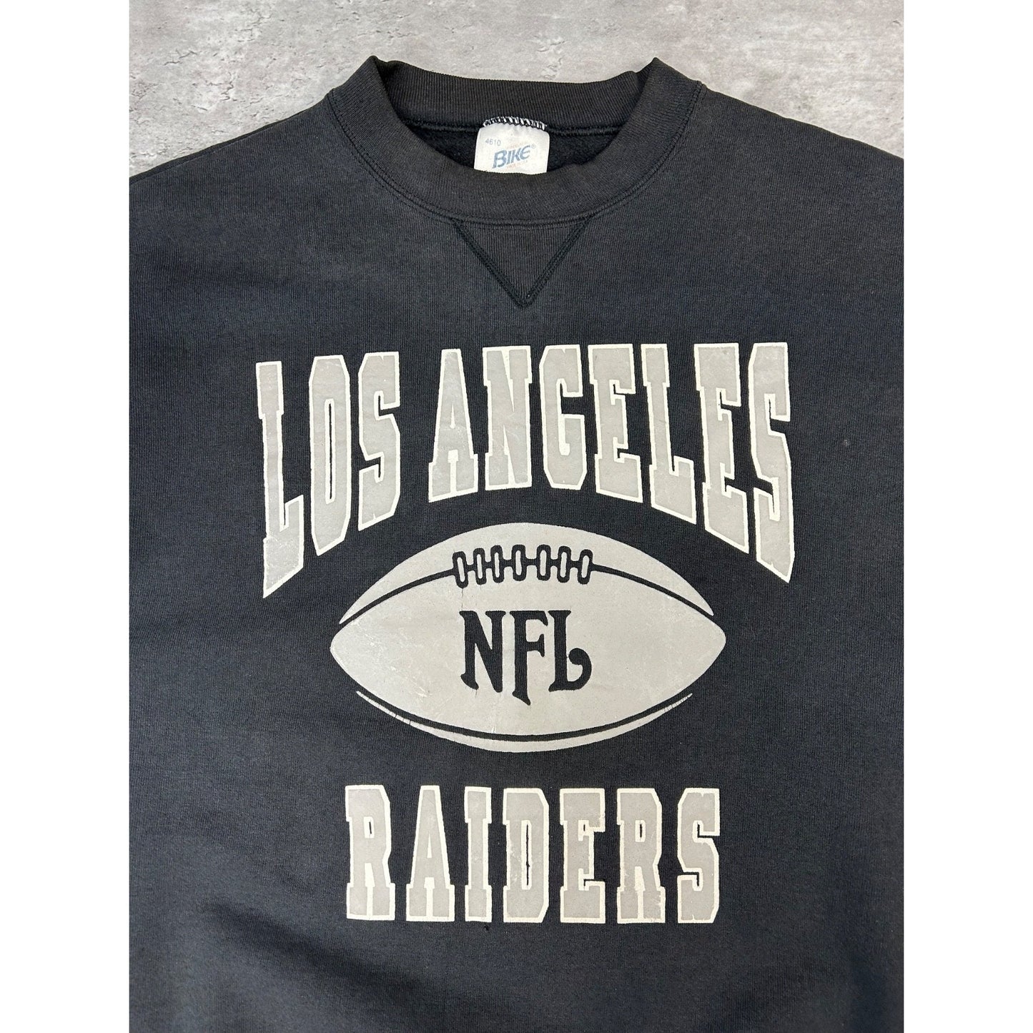 Vintage 90s Los Angeles Raiders NFL Spellout Graphic Football Sweatshirt Size XL